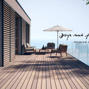 Modern terrace with WPC solid floorboards in different wood tones, modern terrace furniture, view of the sea